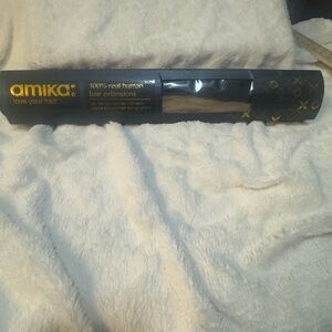 Amika clip in hair extensions color is AM-BL6, unused open box return. …